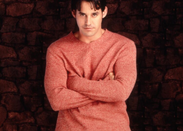 Nicholas Brendon with arms crossed.