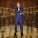 Host Conan O'Brien speaks on stage.