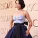 Ji-young Yoo, wearing a strapless two-toned purple gown, poses on the red carpet.