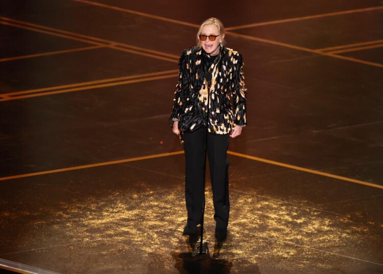 Amy Madigan accepts the supporting actor Oscar for "Weapons" during the 98th Academy Awards.