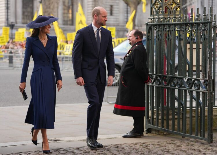 William and Kate arrive for the Commonwealth Day service as protestors demonstrate in the background