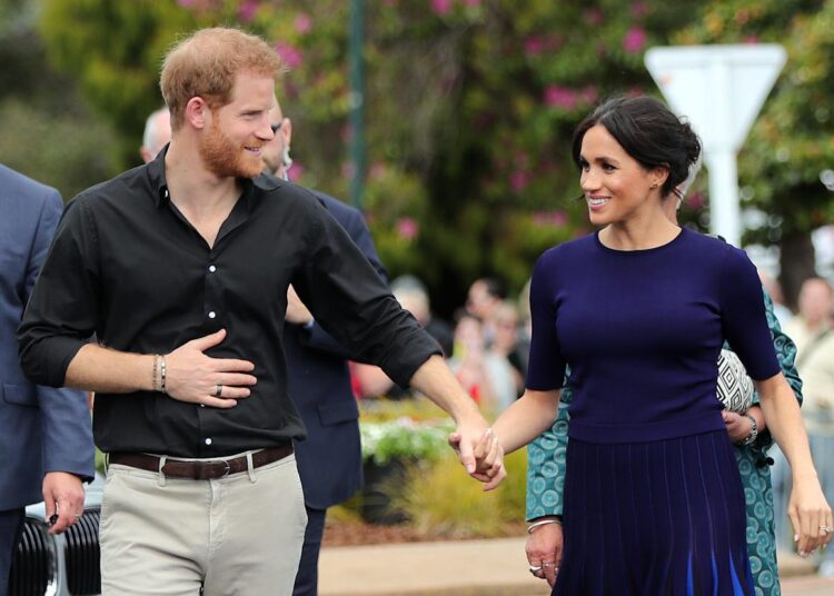 Prince Harry and Duchess Meghan arrive for a public walkabout at the Rotorua Government Gardens in on Oct. 31, 2018, during their first visit to Australia.