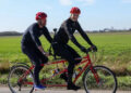 Prince William riding a tandem bike