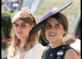 Princess Eugenie in a black hat and Princess Beatrice in a pink hat ride in a carriage at Royal Ascot