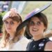 Princess Eugenie in a black hat and Princess Beatrice in a pink hat ride in a carriage at Royal Ascot