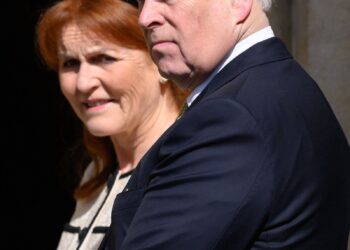 Image may contain Prince Andrew Duke of York Sarah Duchess of York Face Head Person Photography Portrait and Blazer