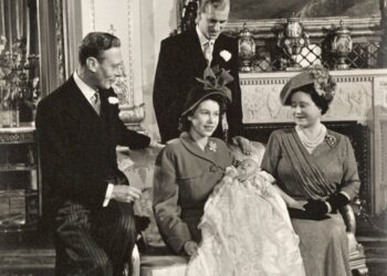 Queen Elizabeth II holding the future King Charles III, who is wearing the gown, on his christening day (Royal Collection Enterprises Limited 2026 | Royal Collection Trust)