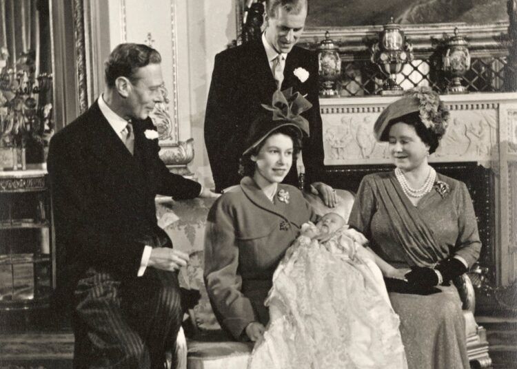 Queen Elizabeth II holding the future King Charles III, who is wearing the gown, on his christening day (Royal Collection Enterprises Limited 2026 | Royal Collection Trust)
