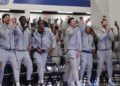 The Queens University of Charlotte men’s basketball team celebrates while viewing the NCAA selection show on CBS on Sunday, March 15, 2026, at Curry Arena. They are a No. 15 seed and will play Purdue.
