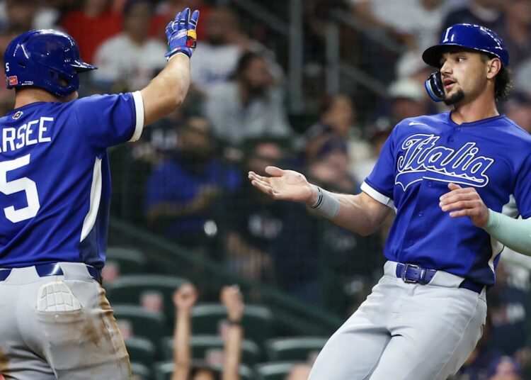 Mar 10, 2026; Houston, TX, United States;  Italy center fielder Jakob Marsee (5) celebrates right fielder Jac Caglianone (14) run against the United States in the sixth inning at Daikin Park. Mandatory Credit: Thomas Shea-Imagn Images