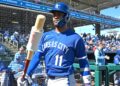 Feb 20, 2026; Surprise, Arizona, USA;  Kansas City Royals third baseman Maikel Garcia (11) on deck for the first inning against the Texas Rangers at Surprise Stadium. Mandatory Credit: Jayne Kamin-Oncea-Imagn Images
