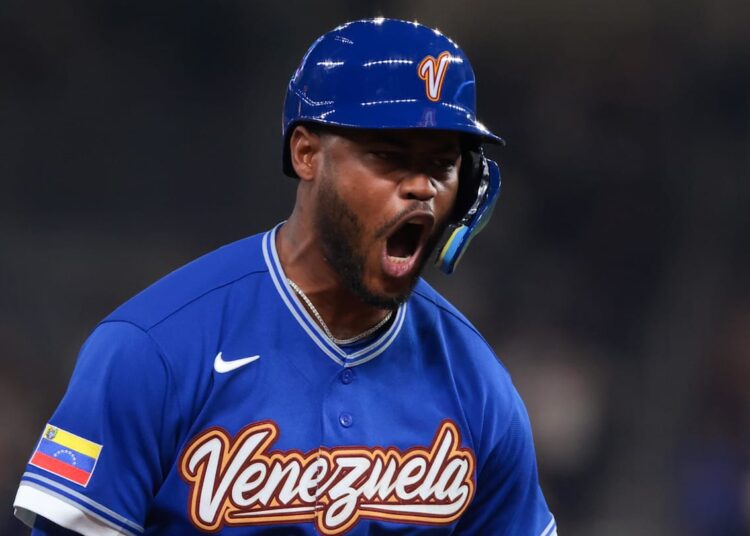 Mar 14, 2026; Miami, FL, United States; Venezuela third baseman Maikel Garcia (11) celebrates after hitting a two-run home run against Japan in the fifth inning during a quarterfinal game of the 2026 World Baseball Classic at loanDepot Park. Mandatory Credit: Sam Navarro-Imagn Images