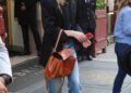 Sarah Pidgeon was spotted in Paris Fashion Week carrying a brown Balenciaga Rodeo bag