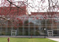 Center for the Performing Arts in spring. Photo taken standing under tress that are just starting to bloom.