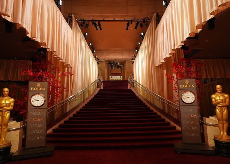 An empty red carpet is seen Saturday, March 14, 2026, at the Dolby Theatre in Los Angeles, the night before Sunday's 98th Academy Awards ceremony. (AP Photo/Gregory Bull)
