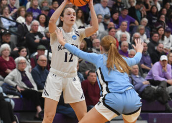 Scranton’s Jenna Sloan (12) is covered by Johns Hopkins’ Lauren...