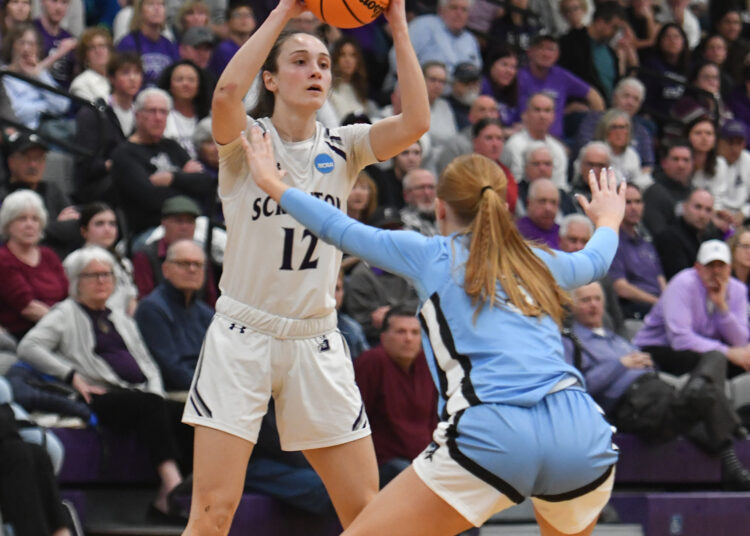Scranton’s Jenna Sloan (12) is covered by Johns Hopkins’ Lauren...