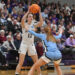 Scranton’s Jenna Sloan (12) is covered by Johns Hopkins’ Lauren...