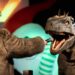 Host Shane Hartline holds a conversation with a life-size dinosaur puppet.