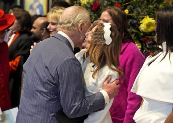Spice Girl Geri Halliwell kisses King Charles at royal event