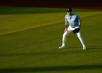 Kansas City Royals outfielder Lane Thomas (15) ready for a fly ball during an MLB spring training baseball game against the Los Angeles Dodgers on March 17th, 2026 in Surprise, AZ.