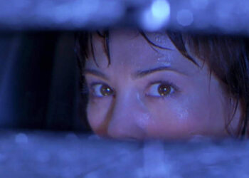 Michelle Mancini looking in the rearview mirror in Urban Legend