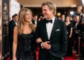 Jennifer Aniston and Brad Pitt smiling and walking arm-in-arm on the red carpet at Gala for Hope 2024