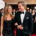 Jennifer Aniston and Brad Pitt smiling and walking arm-in-arm on the red carpet at Gala for Hope 2024