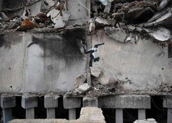 The media may have unmasked Banksy — again. That's angered some art fans but not ruffled dealers