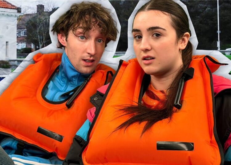 Jamie Bisping and Lucia Keskin sit in a pedalo in orange lifejackets