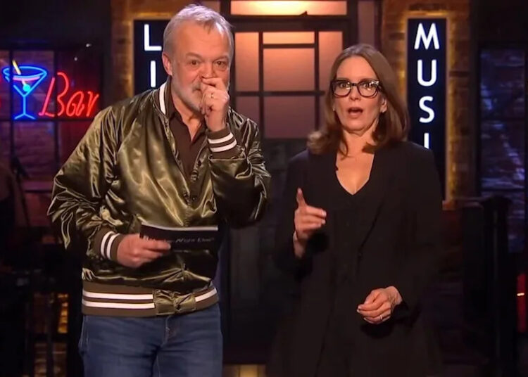 Graham Norton and Tina Fey onstage during the monologue for SNL UK
