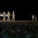 An Army carry team moves the flag-draped transfer case containing the remains of U.S. Army soldier Maj. Sorffly Davius, of Cambria Heights, N.Y., who died in Kuwait, during a casualty return, Monday, March 9, 2026, at Dover Air Force Base, Del. (AP Photo/Julia Demaree Nikhinson)