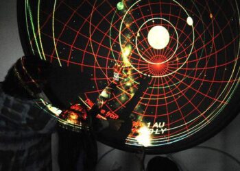 Visitors in the planetarium look at a map of the solar system, during a past year’s Stanislaus State Science Day.