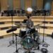Man plays drums