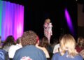 Drag show host Dee Dee Purr addressing the audience. Photo by Skylar Jensen.