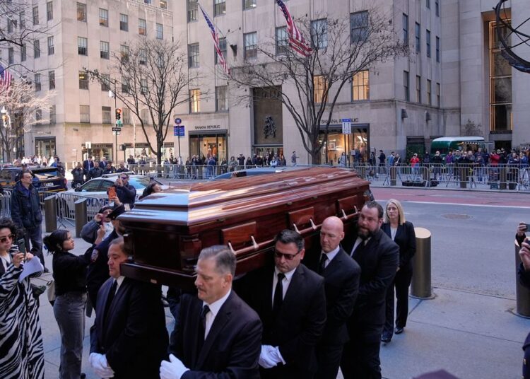 The body of Willie Colon is brought into St. Patrick's Cathedral during his funeral in New York on Monday, March 9, 2026. (AP Photo/Seth Wenig)