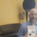 David Arditi holding his new book Music Technology Panic Narratives Beyond Piracy: From Taping to Napster to TikTok" style="height:1020px; width:1620px;" src="https://cdn.prod.web.uta.edu/-/media/1ac2456b9bb647f19860b14236eb836d.jpg?la=en&h=1020&w=1620" _languageinserted="true