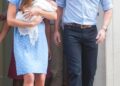 Kate Middleton carrying a baby Prince George and walking with Prince William