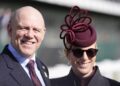Zara and Mike Tindall smiling at the Cheltenham races