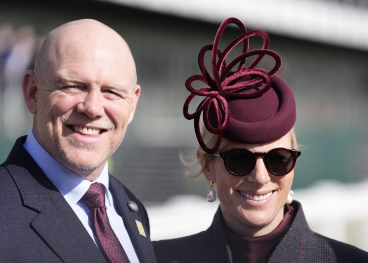 Zara and Mike Tindall smiling at the Cheltenham races