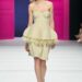 Model walking the runway in a unique fashion design.
