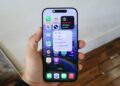 A hand holding an iPhone 16 Pro Max