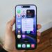 A hand holding an iPhone 16 Pro Max