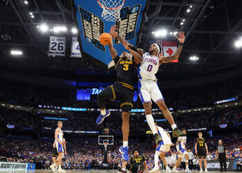 Cam Manyawu #3 of the Iowa Hawkeyes shoots the ball against Boogie Fland #0 of the Florida Gators during the second half in the second round of the 2026 NCAA Men's Basketball Tournament at Benchmark International Arena on March 22, 2026 in Tampa, Florida.