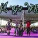 Stilt walkers in costume await photo opportunities during the Sick New World festival at the La ...
