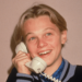 A young Leonardo DiCaprio poses for a picture while talking on a telephone, circa 1989 -