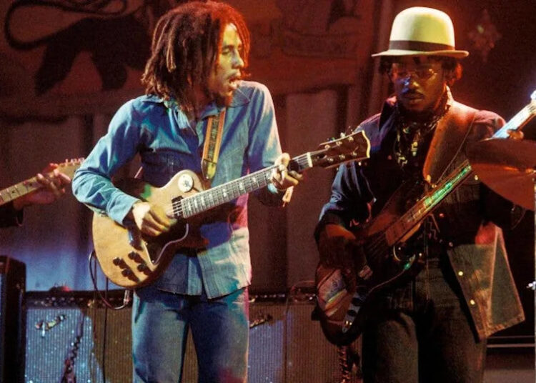 Aston BARRETT and Bob MARLEY, Bob Marley performing live on stage at the Odeon with Aston 'Family Man' Barrett.Photo by Ian Dickson&sol;Redferns