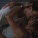 A couple does a dip, embracing and smiling.