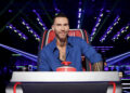 Adam Levine sitting and smiling in his judging chair on The Voice Season 29 Episode 2.