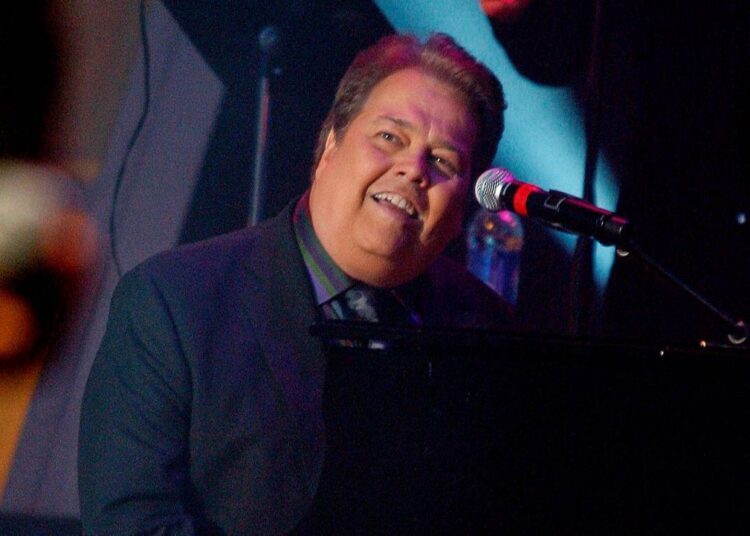 Alan Osmond performs during a taping of the Osmonds 50th anniversary show in Las Vegas on Aug. 14, 2007. (AP Photo/Isaac Brekken, File)